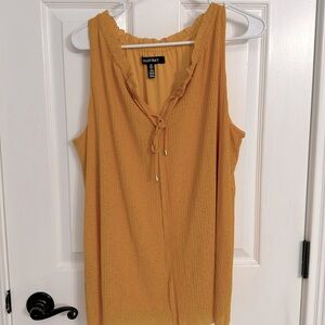Gold/yellow lined sleeveless stretchy top. SzL slight ruffle v neck ties NWOT